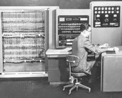 man operating a mainframe computer