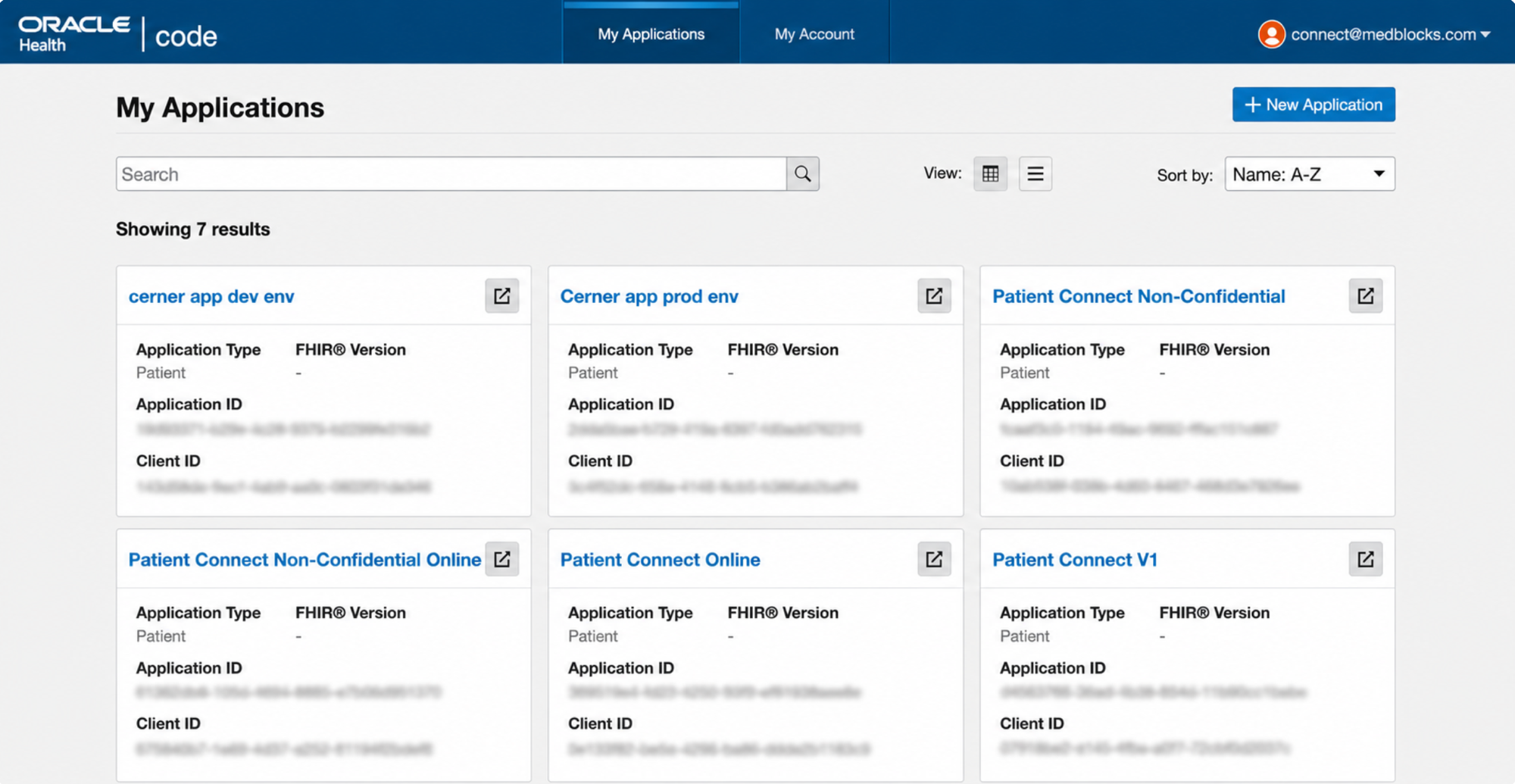 Cerner Code Console My Applications page listing existing registered apps with Application Type, Application ID, and Client ID for each, and a + New Application button in the top right